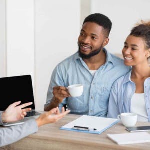 Couple Of Homeowners Consulting About Their Finances