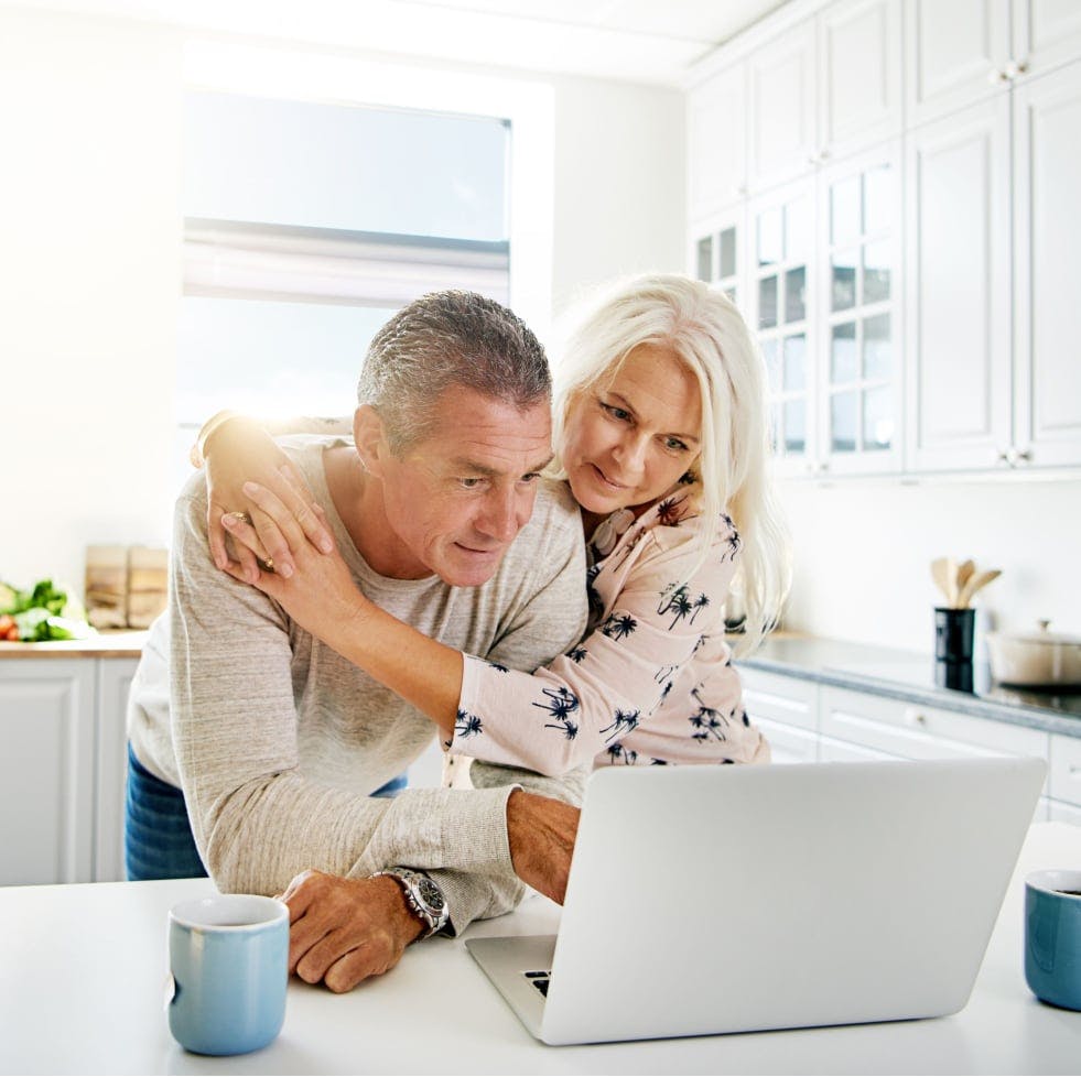 Couple with their newborn child happy after a successful cash-out refinance through House Numbers